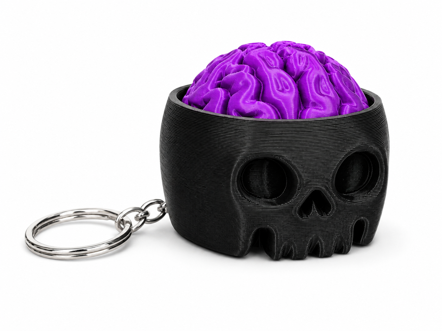 Portachiavi Skull Brain — Portachiavi Halloween NAMII Skull Brain 3D stampato, con teschio nero e cervello viola.